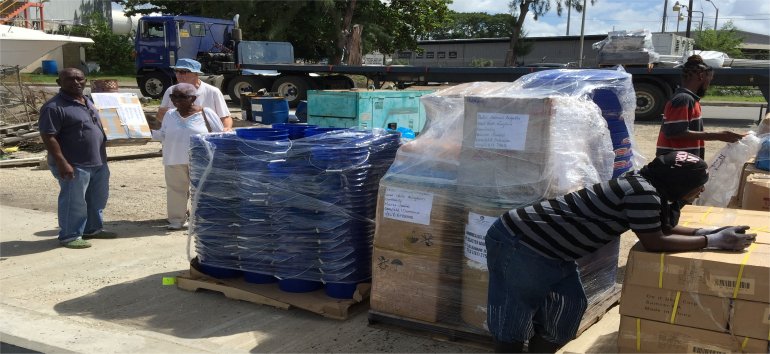 United Caribbean Trust partnering with The Living Room shipping Sawyer PointOne Water Filtration Systems in Dominica following hurricane Maria