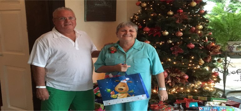 Philip Edwards from The Living Room partnering with St. Nicholas Abbey to distribute Christmas gifts to the children of Dominica