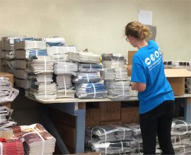 Logos Hope volunteers come to pack and sort Love Packages for the churches of Dominica