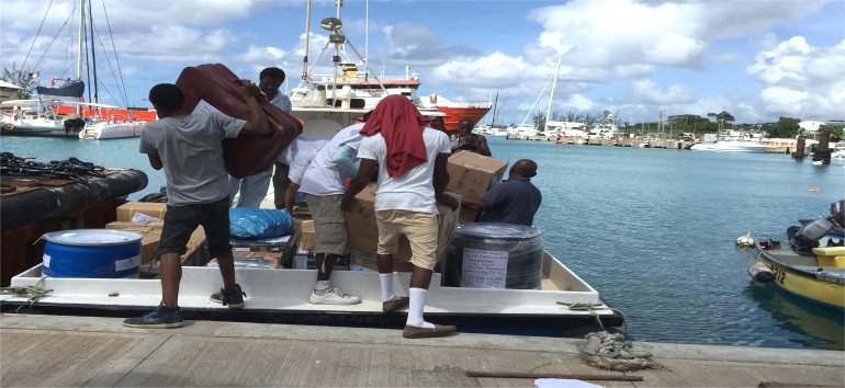 United Caribbean Trust partnering with The Living Room shipping Sawyer PointOne Water Filtration Systems in Dominica following hurricane Maria