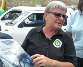 Jenny Tryhane the Founder of United Caribbean Trust distributing Sawyer PointOne Filter in Dominica llowing the hurricane Maria in 2017
