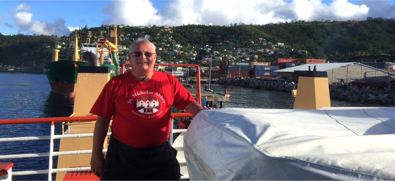 Philip Edwards from The Living Room partnering with St. Nicholas Abbey to distribute Christmas gifts to the children of Dominica