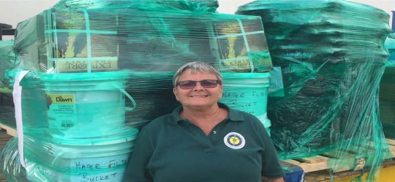 Jenny Tryhane founder of United Caribbean Trust partnering with The Living Room distributing Sawyer PointOne Water Filtration Systems in Dominica following hurricane Maria